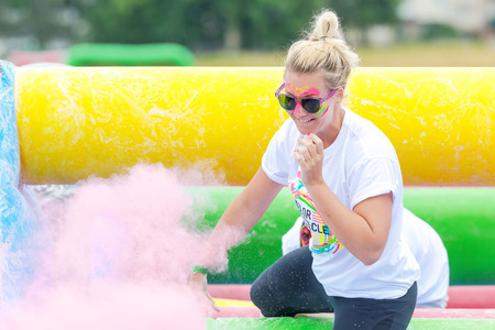STOCKHOLM, SWEDEN - JULY 22, 2017: Woman at the color obstacle rush at Gardet in Stockholm. 15...