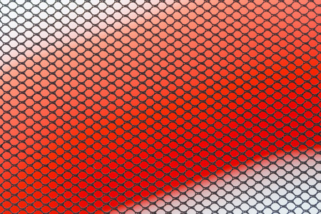 STOCKHOLM, SWEDEN - JULY 22, 2017: Textures of a net with colorful background at the color obstacle rush at Gardet in Stockholm. 15 obstacles, 6 colors and 5k running.の写真素材