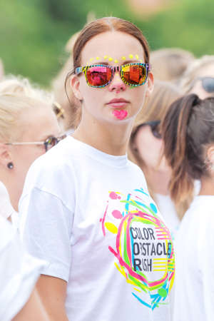 STOCKHOLM, SWEDEN - JULY 22, 2017: Female face with glasses at the color obstacle rush at Gardet in...
