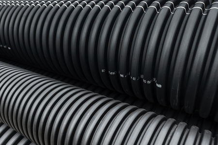 GRISSLEHAMN, SWEDEN 30, SEPT 2017: Black PVC plastic pipes in a pile during construction.のeditorial素材