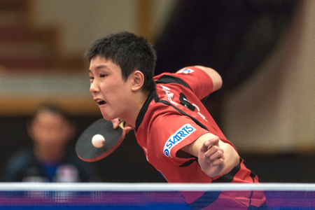 STOCKHOLM, SWEDEN - NOV 17, 2017: Tomokazu Harimoto (Japan) against Xu Xin (China) at the table tennis tournament SOC at the arena Eriksdalshallen in Stockholm.のeditorial素材