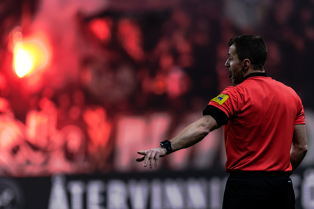 SOLNA, SWEDEN, MARCH, 18, 2018: Referee with tifo backdrop at the Svenska cupen semifinal. Djurgarden won with 2-0 and is in the final against Malmo FFのeditorial素材