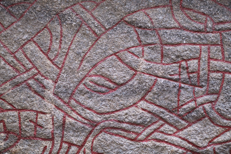 STOCKHOLM, SWEDEN, APRIL, 1, 2018: Detail of viking Rune Stone in Gamla Stan, Stockholm Old Town in the corner Prastgatan and Kakbringen.のeditorial素材