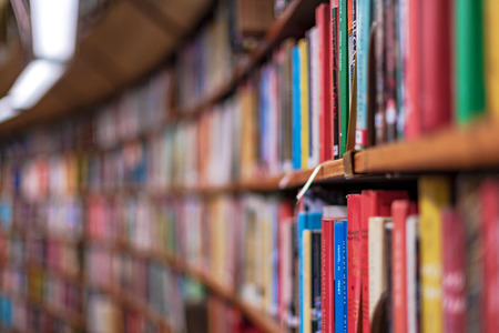 Colorful books in rows at a big bookshelf. Swedenの写真素材
