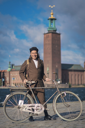 STOCKHOLM, SWEDEN, SEPT 22, 2018: Bike in tweed bicycle tour with vintage bikes and clothes. Before start with backdrop of city hall.のeditorial素材