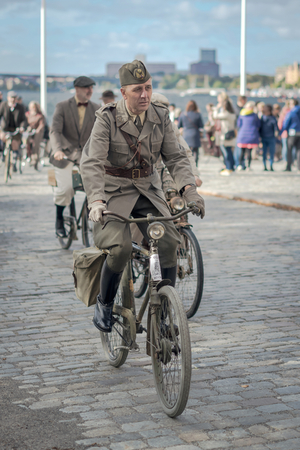 STOCKHOLM, SWEDEN, SEPT 22, 2018: Bike in tweed bicycle tour with vintage bikes and clothes. Before start with backdrop of city hall.のeditorial素材