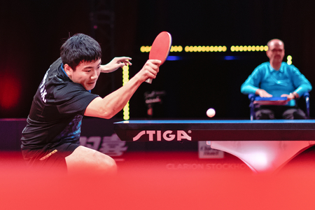 STOCKHOLM, SWEDEN - NOV 3, 2018: Zhendong Fan (CHI) vs Jingkun Liang (CHI) at the table tennis tournament SOC at the arena Eriksdalshallen in Stockholm.のeditorial素材