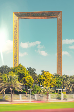 Dubai frame with its golden color rises inbetween the old and new Dubai. Attraction ready for the public in 2017の写真素材