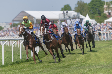 STOCKHOLM, SWEDEN - JUNE 6, 2019: Horse racing during sunny weather at Nationaldags Galoppen in Gardet field in the middle of Stockholm.のeditorial素材