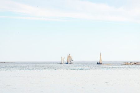 GRISSLEHAMN, SWEDEN - JUN 15, 2019: Classic postal rowing contest between Grisslehamn and Eckero in vintage clothes and boats. Sunny weatherのeditorial素材