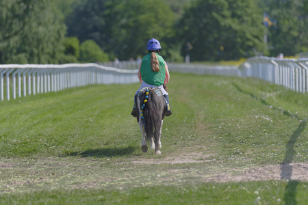STOCKHOLM, SWEDEN - JUNE 6, 2019: Ponnyracing during sunny weather at Nationaldagsgaloppen at Gardet, Stockholm.のeditorial素材
