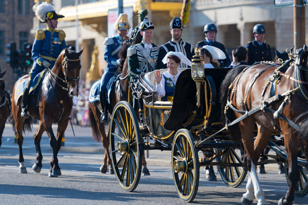 STOCKHOLM, SWEDEN - JUNE 6, 2019: The carriage with the Queen Silvia and Princess Sofia waving their hands at Royal cortege during the national day of Sweden, June 6th.のeditorial素材