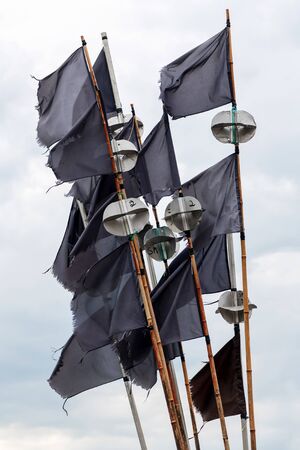 Fisherman markers with black flags and metal radar reflectors on top. Swedenの写真素材