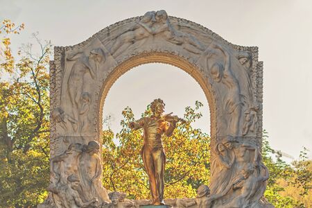 Monument of an golden Johan Strauss in the Stadtpark in Vienna.の写真素材