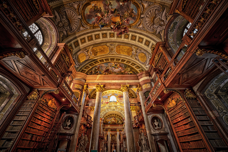 VIENNA, AUSTRIA, OCTOBER 26, 2019: Old library of Vienna with the ceiling paintings and ornaments of the building.のeditorial素材