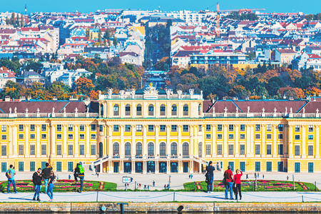 VIENNA, AUSTRIA, OCTOBER 24, 2019: The top section of the Schoenbrunn palace as seen from the Gloriette with tourist in the foreground.のeditorial素材