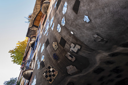 VIENNA, AUSTRIA, OCTOBER 23, 2019: Detail of an Hundertwasser house, Hundertwasserhaus - apartment house, idea and concept of Austrian artist Friedensreich Hundertwasser. Colorful facade with growing trees, Autumnのeditorial素材