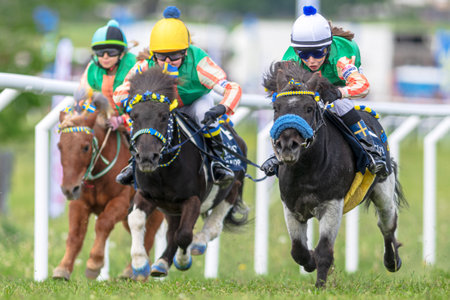 STOCKHOLM, SWEDEN - JUNE 6, 2022: Ponny horses with young jockeys at the Nationaldagsgaloppen in Stockholm.のeditorial素材
