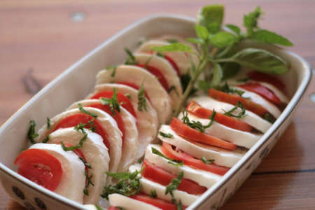 Caprese salad with tomato and mozzarellaの写真素材