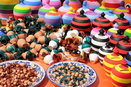 Stall of colored pottery at a village fairの写真素材