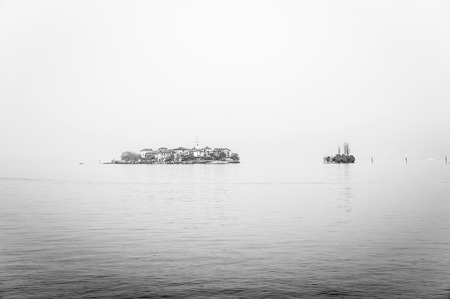 Island of Lake Maggiore, Italy, on a winter day with fogの写真素材
