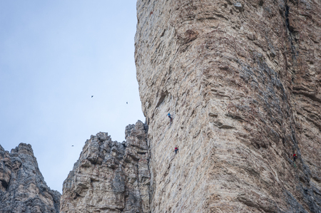 climbers climbing on the rocks of the Alpsの写真素材