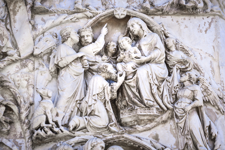 Detail of the facade of the Duomo of Orvieto, Umbria Italy. Marble bas-relief representing episodes of the bible. Adoration of the Magi Kingsの写真素材