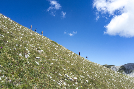 men and women strolling along the mountain ridgeのeditorial素材
