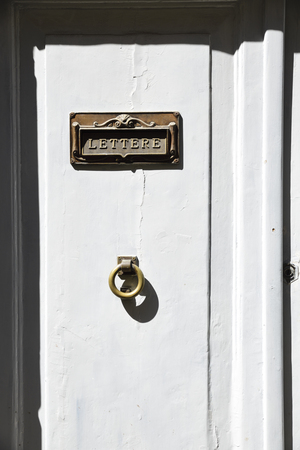 Mailbox on the white door.の写真素材