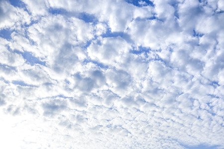 blue sky background with white and fluffy clouds