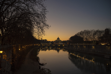 view from the tiber river of St. Peter's Basilica at sunset, Vatican, Rome, Italyのeditorial素材