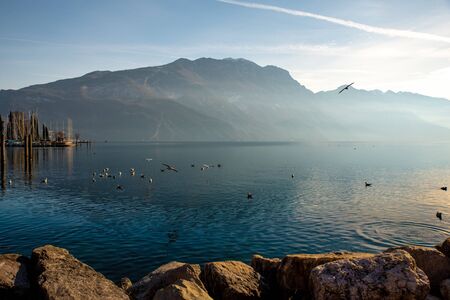 Riva del Garda.Lake Garda in northern Italy. Melancholic and romantic view of the lake at sunset