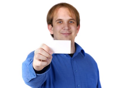 businessman holding out blank business card - focus on cardの写真素材