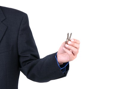 Businessman offering keysの写真素材