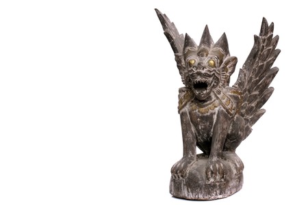 Antique asian wooden carved sculture over whiteの写真素材