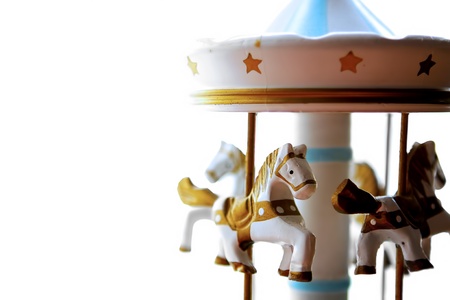 Detail of carillon of horses on white background