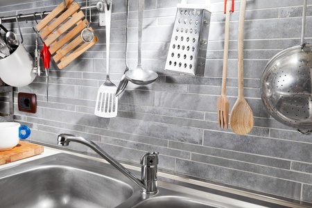 Kitchen tools on a grey tile marble wall from above
の写真素材