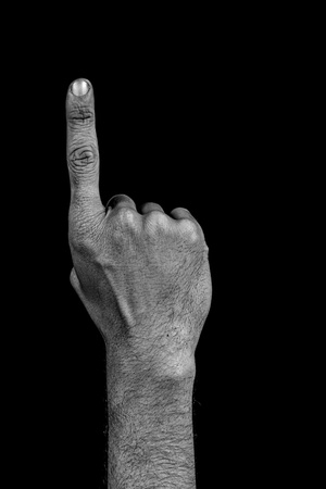 number one composed by a grunge hand isolated on black backgroundの写真素材