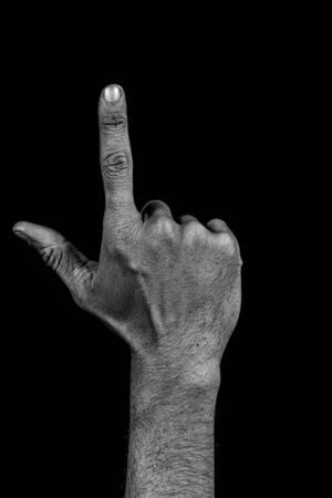 number two composed by a grunge hand isolated on black backgroundの写真素材