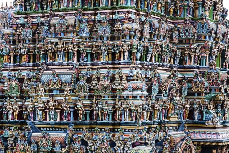 texture formed by the detail of colorful statues of a temple typical of the south of Indiaの写真素材