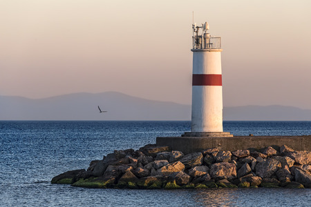Tower like a lighthouse with modern control units on its top for collecting environmental and meteorological data.の写真素材