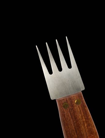 fork with wooden handle isolated on black