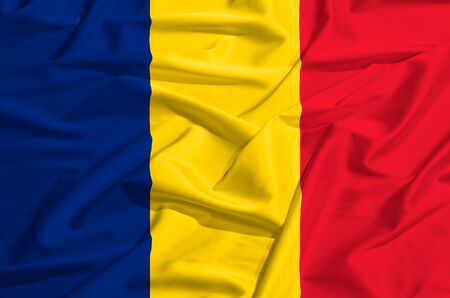 Romania flag on a silk drape wavingの写真素材