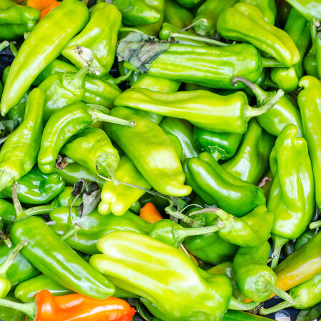 Green peppers on a desk of market in italy