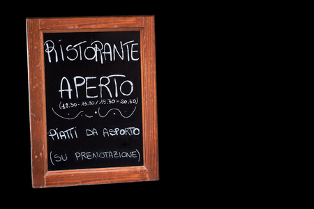 blackboard outside an open italian restaurant isolatedの写真素材