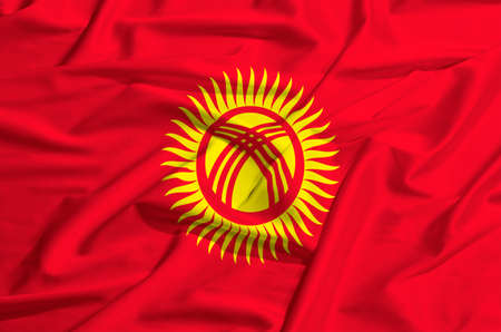 Kyrgyzstan flag waving on a silk drapeの写真素材