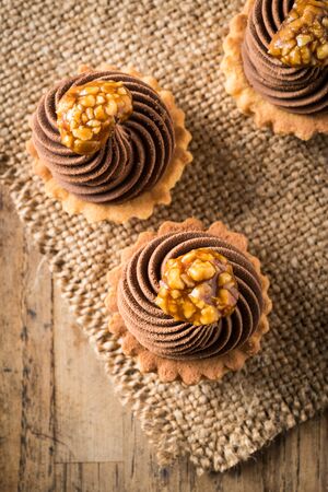 chocolate and caramel small tart homemadeの写真素材
