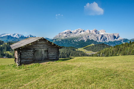wooden house in mountain landscape of alto adige, northern italyの写真素材