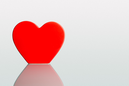 Valentine big heart on a plain pastel background as greeting card and copyspaceの写真素材