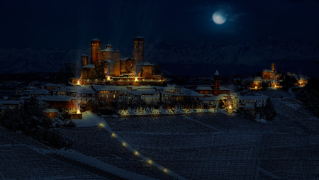 Fantasy photomanipulation of medieval landscape in winter on night with castle and citiesのeditorial素材